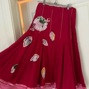 Beautiful red and pink skirt with flowers and stitching
